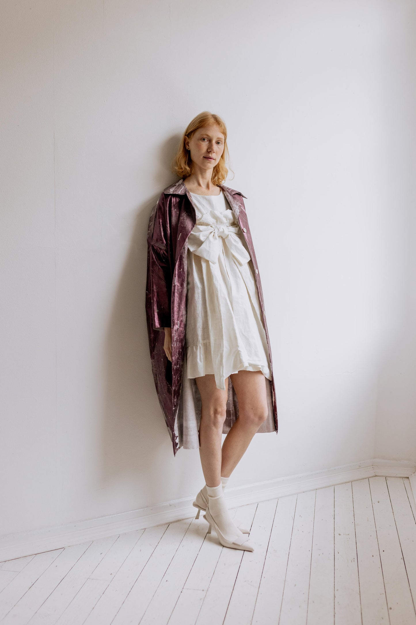 MINI BOW DRESS - PEARL | A new shape for AW23, The Bow Dress is one of our most playful. The dress is an oversized shape with gathered tiered details. The frill and bow detail at the front is the show-stopper. Cut in an oversized shape - you can wear her