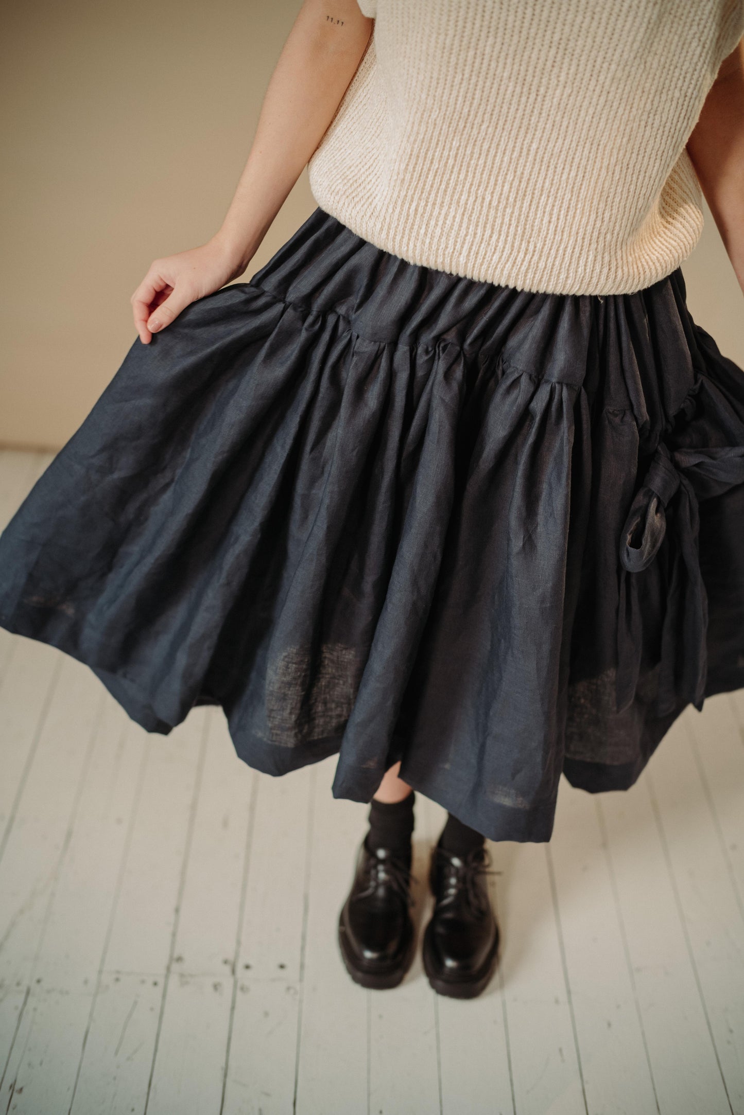 LINEN TUTU | The linen tutu - because no one ever really grows up enough to not want to wear a tutu! Voluminous, romantic and feminine, the tutu features two gathered layers with an oversized bow in a luxurious dark navy. Side seam pockets. Made with 100%