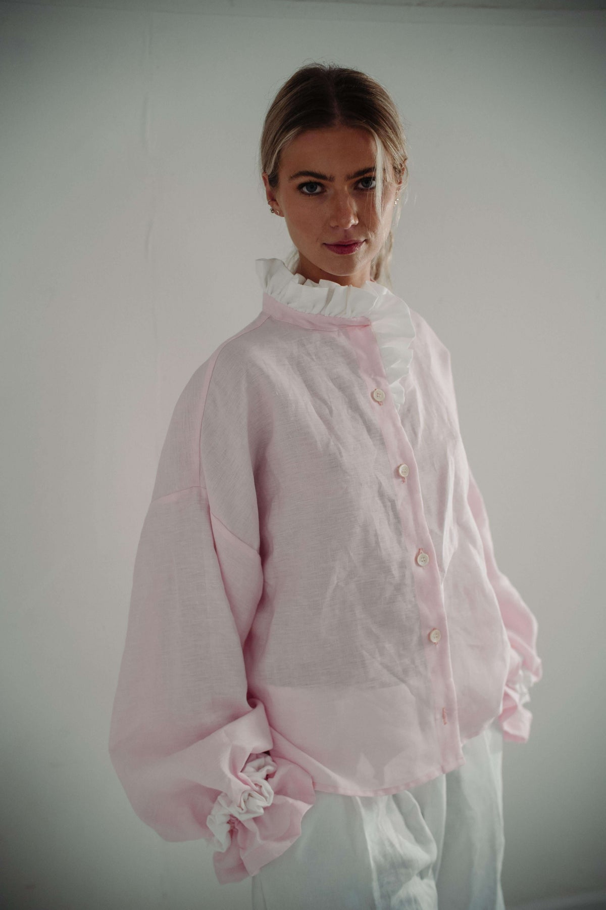 MARSHMALLOW BLOUSE | The Marshmallow Blouse is a fun interpretation of a favourite summer memory of toasting marshallows round the fire on the beach. The shirt features an assymetric frill detail on the collar - one side has structured white frills and th
