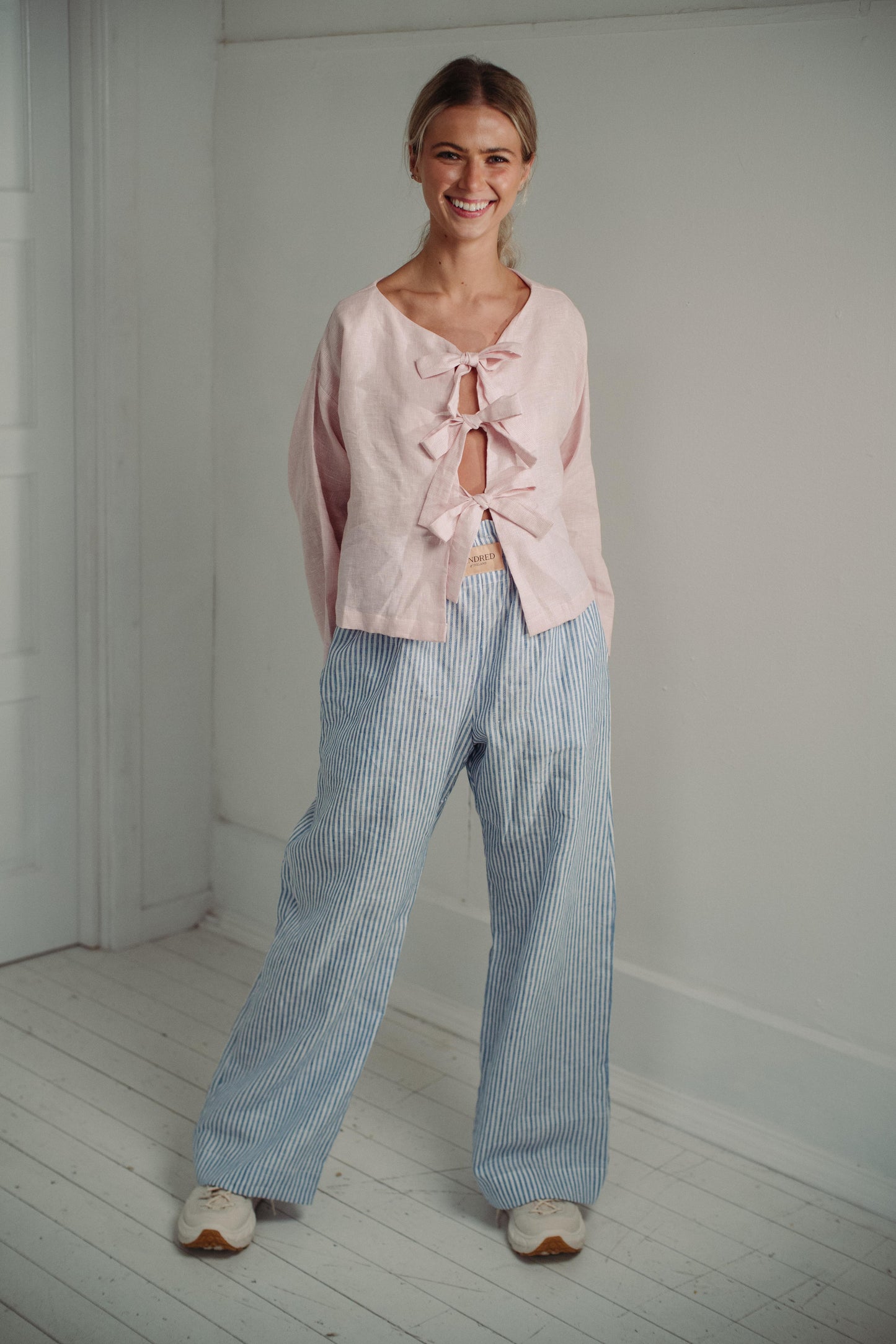 PINK TIE SHIRT | As part of our 'day-wear pyjamas' collection, the tie shirt is a new shape for us. Wear with bows to front or to the back, this top feels effortless and easy to wear, yet makes a little bit of a statement. Created with a soft pink/white c
