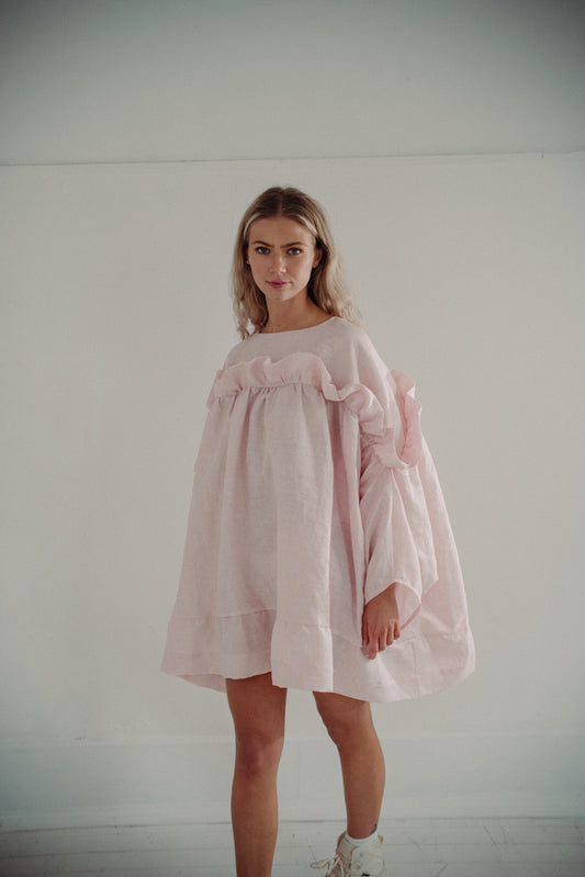 LEILA MINI DRESS | PINK | A new silhouette for Spring/Summer. The Leila dress is a fun 'baby doll' style which features our signature 'puff' frill and ties in a delicate bow at the back. Created with a soft pink/white check linen, this dress is the perfec