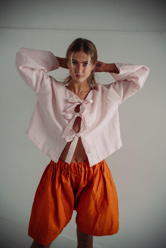 SOLERO SHORTS | Baggy, oversized shorts with an elasticated waistband. Created with bright orange linen, these shorts are a statement yet so comfortable and wearable.